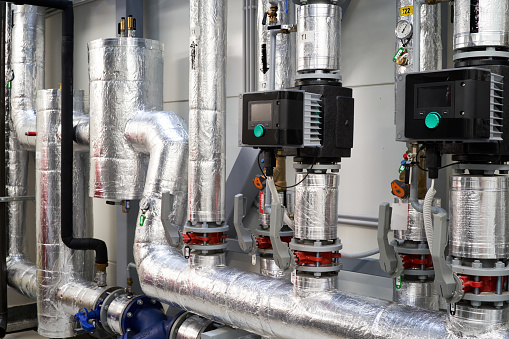 boiler room plant tubes valves circulating water pump.