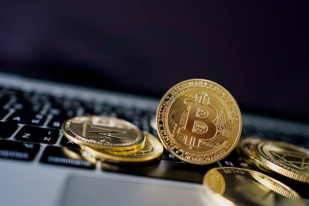 Photo Golden Bitcoins On laptop. Trading Concept Of Crypto Currency. Photo Golden Bitcoins On laptop. Trading Concept Of Crypto Currency. bitcoin trading stock pictures, royalty-free photos & images