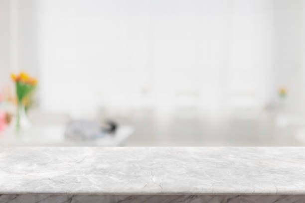 istock Empty white marble stone table top and blur glass window interior restaurant banner mock up abstract background - can used for display or montage your products. 1318241469