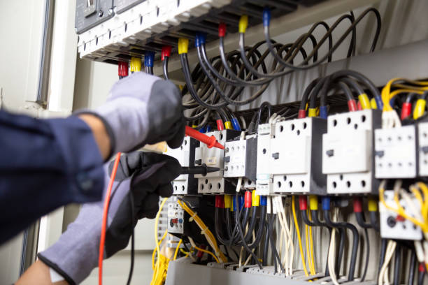 istock Electrician engineer tests electrical installations and wires on relay protection system. Adjustment of scheme of automation and control of electrical equipment. 1318241636