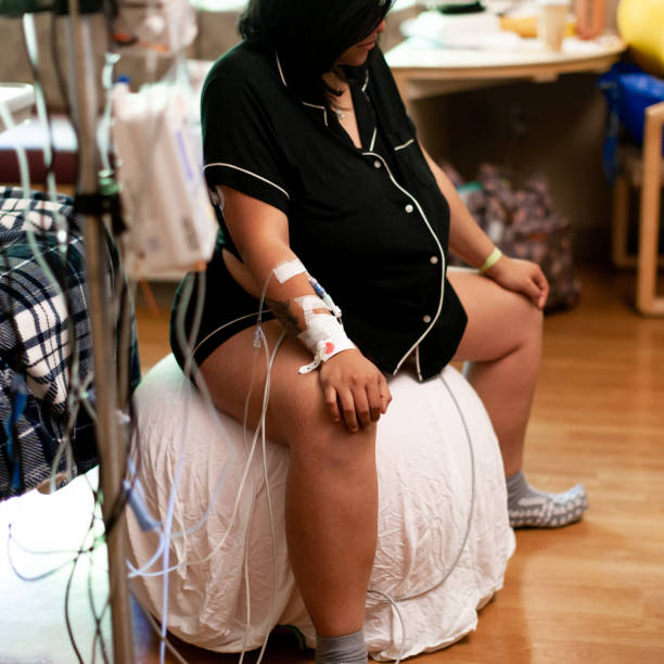 Pregnant Woman Using Exercise ball to help induce active labor