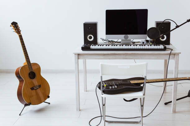 istock Synthesizer keyboard digital recording and guitars, home music record studio concept. Leisure and hobby concept. 1318245701