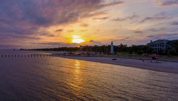 Biloxi, Mississippi at sunset The Biloxi, Mississippi Gulf Coast waterfront at sunset mississippi stock pictures, royalty-free photos & images