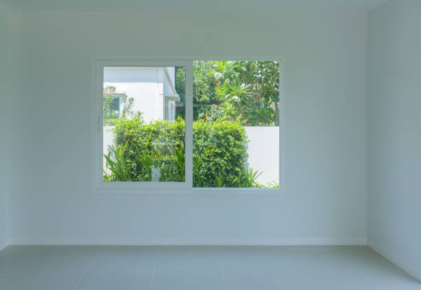 istock Empty room with glass window frame house interior on concrete wall 1318246604