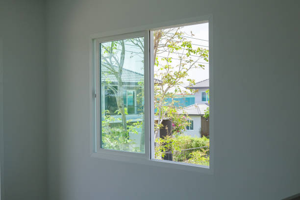 istock Empty room with glass window frame house interior on concrete wall 1318246606