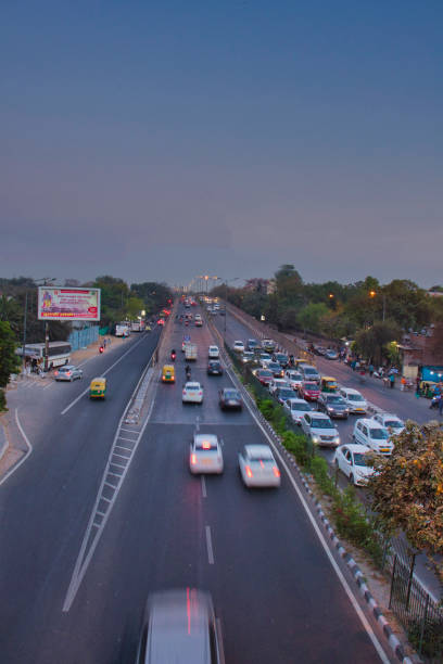 Wide angle view of the moving traffic during evening time on roads of Delhi