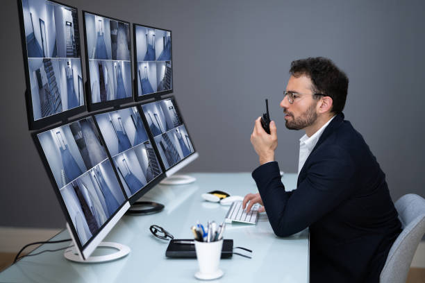 istock Security System CCTV Monitor Room. Man 1318253918