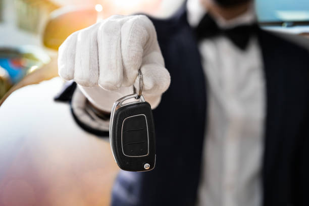 istock Valet Boy Holding A Car Key 1318254516