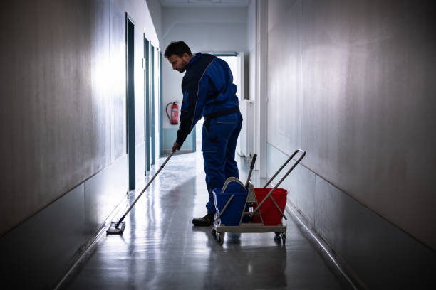 istock Professional Office Janitor Worker Cleaning Floor 1318255147