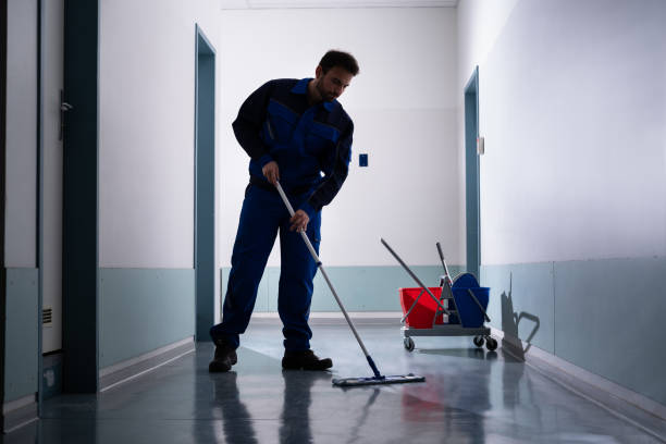 istock Professional Office Janitor Worker Cleaning Floor 1318255153