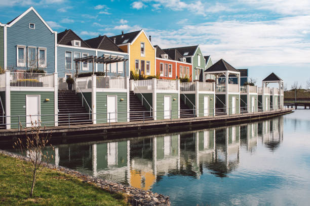 istock Buildings By River Against Sky 1318255853