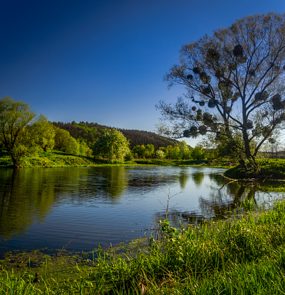 Blue river between green sides