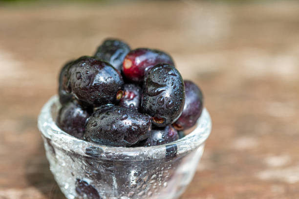 istock Closeup Black plum Java plum Purple Fruits 1318256878