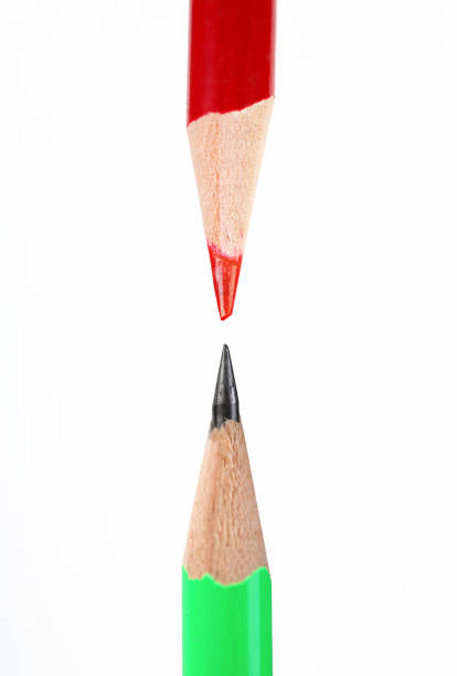 istock Two different colored wood pencil  placed on a white background 1318257735