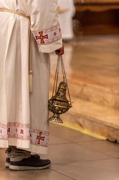 istock priest holding an incense pot 1318258796