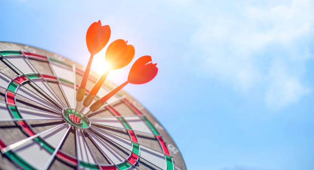 istock Red dart target with arrows ,Image for target business, marketing solution concept.of dartboard with sky background. 1318259130