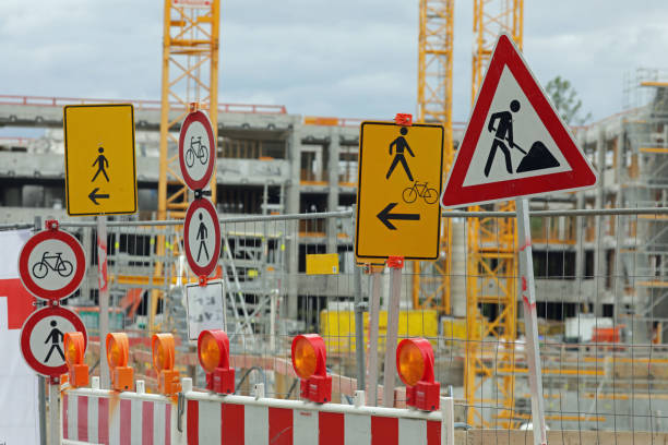 many road signs at a construction site stock photo