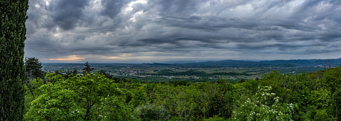 Panoramic view of the landscape in the eastern area of FVG region, Italy, under a stormy sky