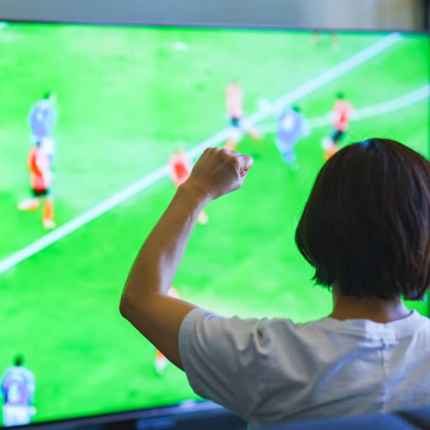 istock Japanese middle aged woman watching TV program 1318265362