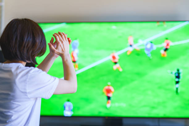 istock Japanese middle aged woman watching TV program 1318265372