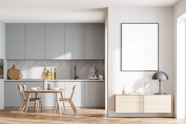 istock Bright cozy kitchen room interior with dining table and poster 1318265681