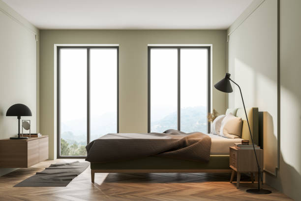 istock Light bedroom interior with bed, linens and window 1318265737