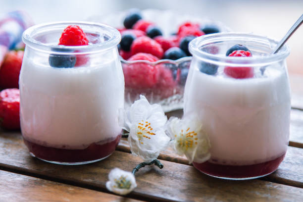 istock yoghurt with raspberries and blueberries on wooden background 1318265969