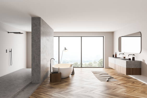istock Bathroom interior with bathtub, sinks and shower with window on countryside 1318267202