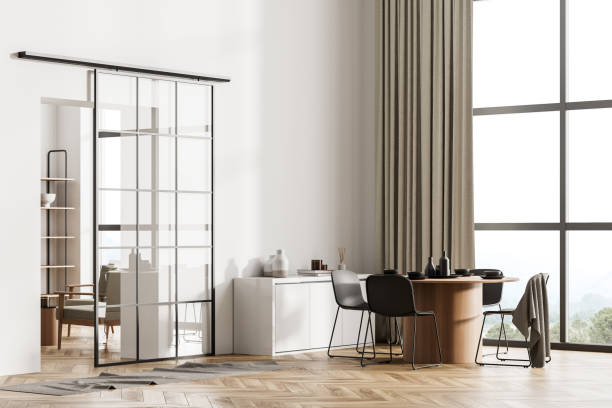 istock White living room interior with chairs and table, window and parquet floor 1318267915
