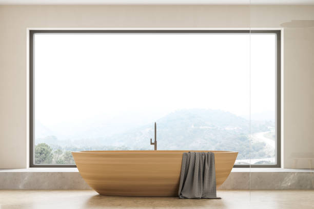 istock Beige bathroom interior with bathtub on concrete floor 1318267922