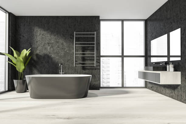 istock Bathroom interior with bathtub and sink, window and parquet floor 1318268291