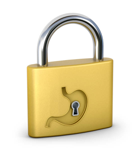 istock Engraved stomach shape on a golden lock. Safety concept. 3d illustration. 1318268347
