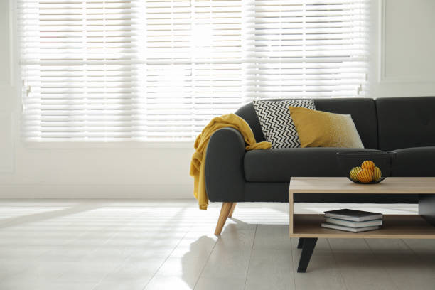 istock Stylish living room interior with comfortable grey sofa and table 1318269416