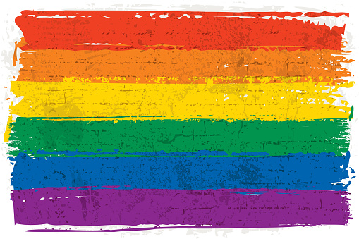 Vector illustration of a rainbow flag over a textured wall. Graffiti style rainbow flag. Hand-painted rainbow flag over a rough wall background.