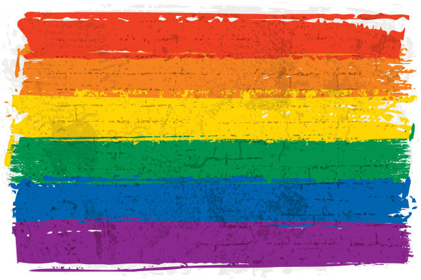 Graffiti rainbow flag Vector illustration of a rainbow flag over a textured wall. Graffiti style rainbow flag. Hand-painted rainbow flag over a rough wall background. pride month stock illustrations