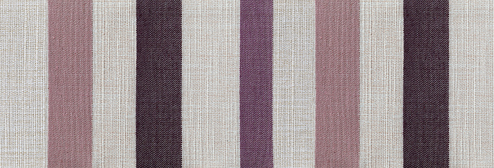 Fabric texture canvas. Cotton background. Detail close up for dress or other modern fashion textile print. purple and gray striped textured design.