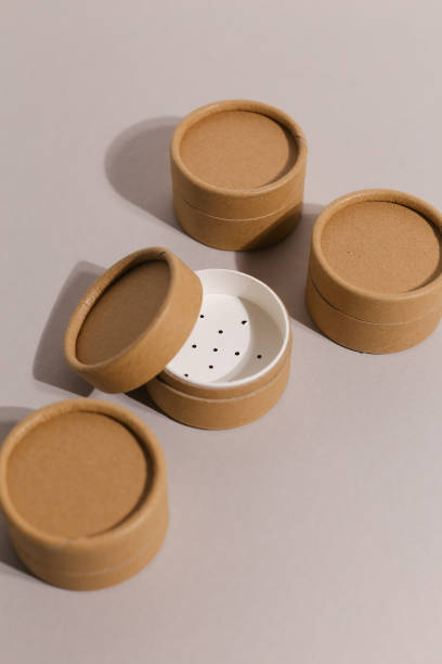 istock Recyclable paper tube with paper cap, cardboard container for packaging isolated on white background with copyspace, mockup. Recyclable packaging and zero waste concept 1318273658