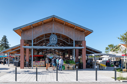 Lacanau, France - 05-08-2021: Inaugurated in August 2019, the Halles de la Gaité (halls of gaiety) host the weekly market every Saturday morning in the downtown area of this small seaside resort of the French Atlantic coast.