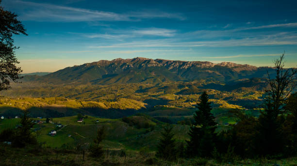Sirnea touristic village Brasov. Bucegi mountains seen from Sirnea stock photo