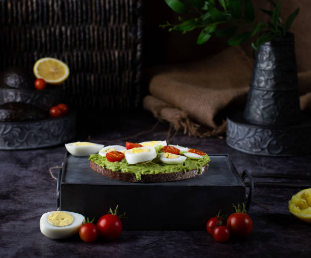 Heathy avacado eggs and cherry tomatoes toast for breakfast