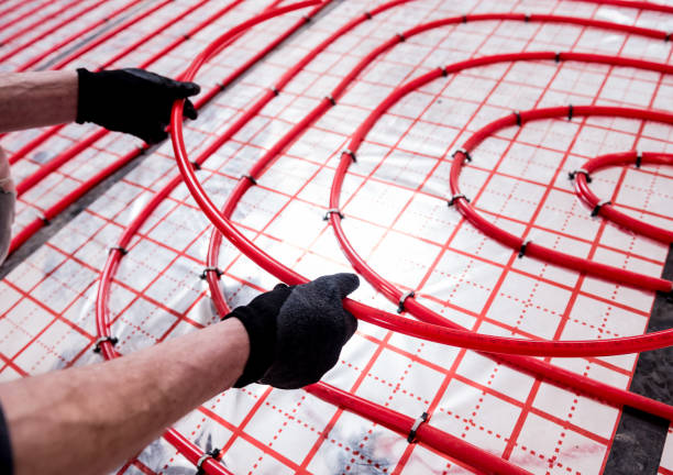 Pipefitter install system of underfloor heating system at home