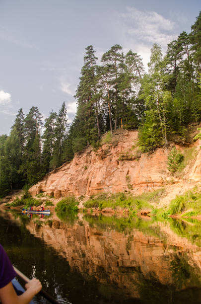 istock Boat trip down the river Salaca. Beautiful sand stone cliffs, Latvia 1318283078