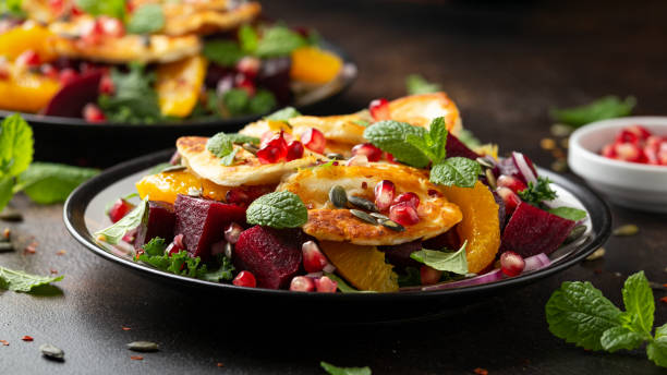 istock Fried Halloumi Cheese salad with beetroot, orange, pomegranate and pumpkin seeds, red onion, green vegetables. healthy food 1318283286