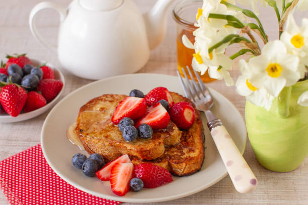 Breakfast with french toast and berry fruits stock photo