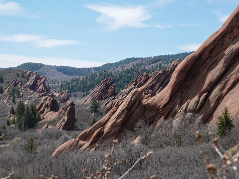 Sloping red rock formations.