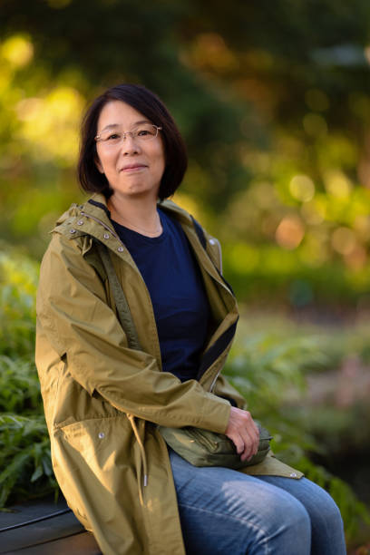 istock Smiling woman sitting in a Forrest 1318287133