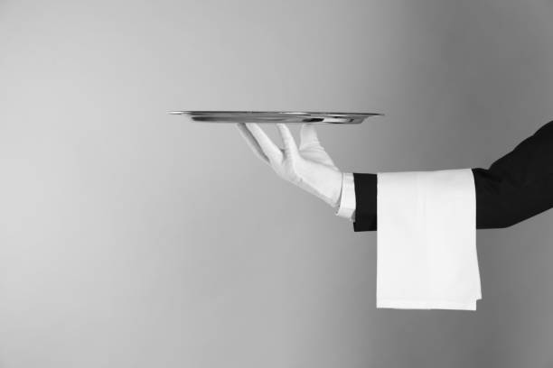 istock Butler with tray on light grey background, closeup. Space for text 1318289370