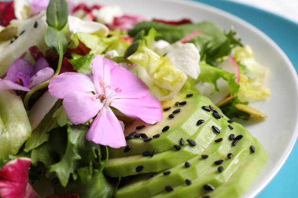istock Fresh spring salad with flowers on plate, closeup 1318290561