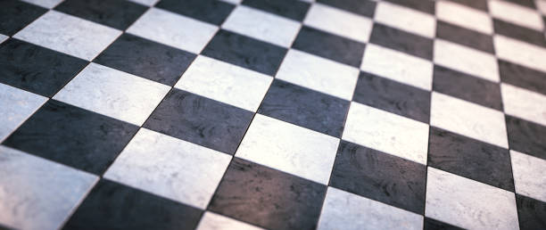 istock Low angle view on a black and white rough tiled floor - defocused wide horizontal composition 1318300688