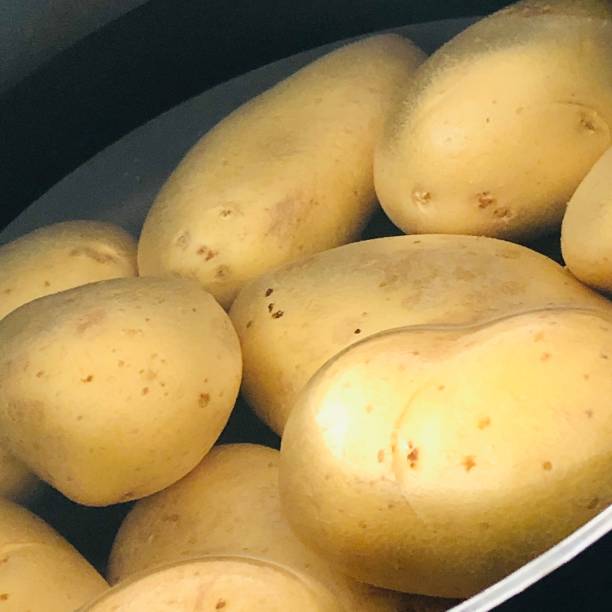istock Potatoe in water 1318300922